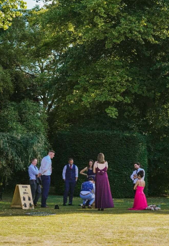 Wedding guests playing games in the garden at a Northamptonshire wedding venue