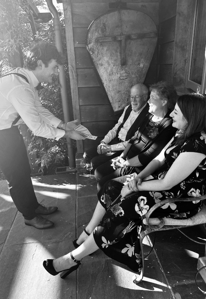 Nicky George performing magic at a wedding