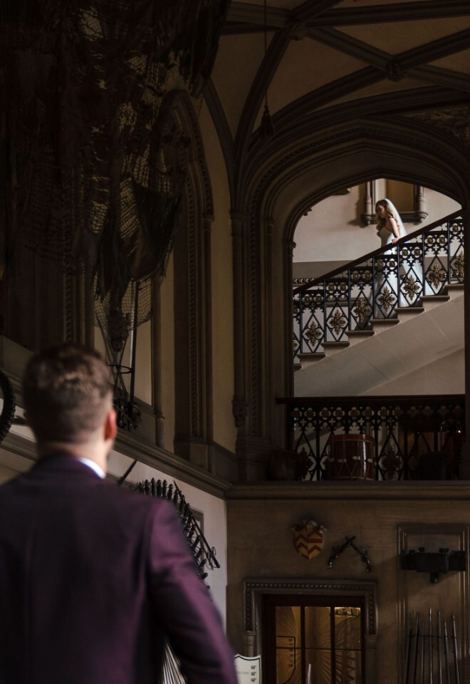 Grrom Looking at bride entering the ceremony in the Guard Room 