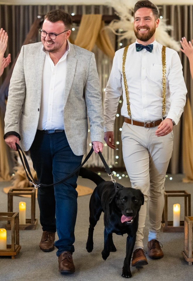 Same sex couple ceremony with dog