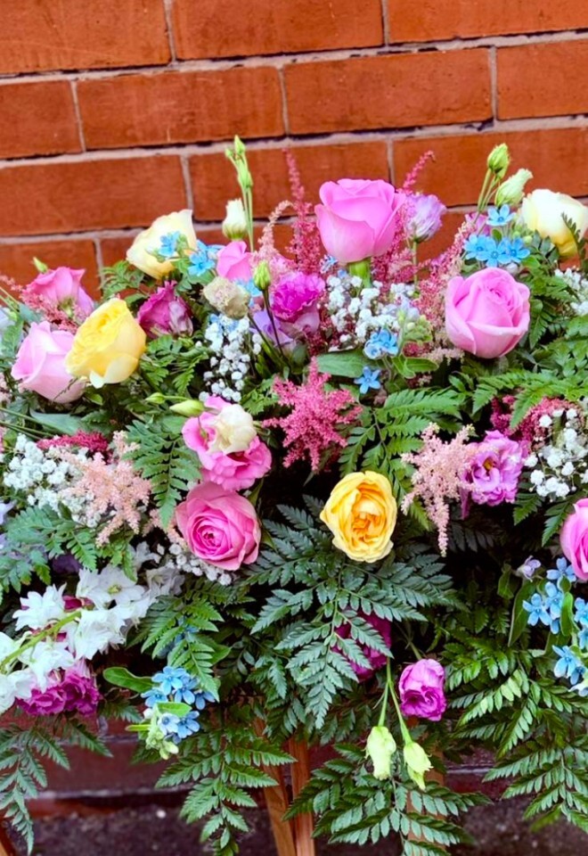 Top table flowers from Perfect Petal, Bolton. pink & yellow roses with greenage.