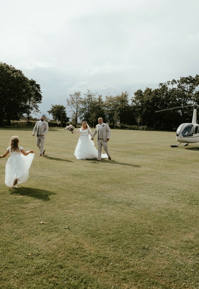 arrive at your wedding by helicopter at hungarian hall estate