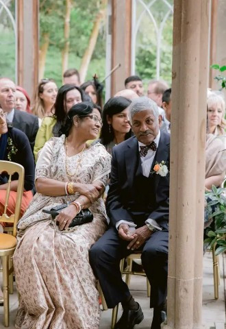 mother and father of the groom await the brides entrance at culzean castle wedding venue ayrshire scotland