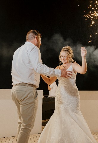 Bride and Groom share their first dance on a yacht surrounded by fireworks, exclusive yacht weddings in cyprus