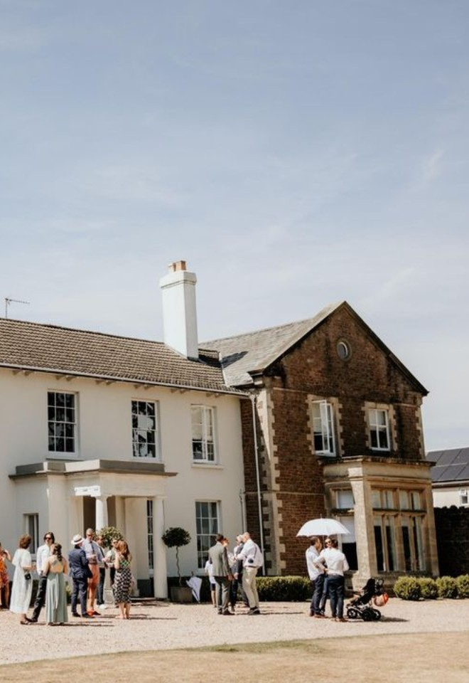Guests stood outside Glewstone Court Country House in Herefordshire