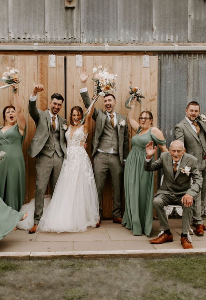 bride, groom, bridesmaids, best man, ushers outside Eden Wedding Barn celebrating the marriage in Cumbria