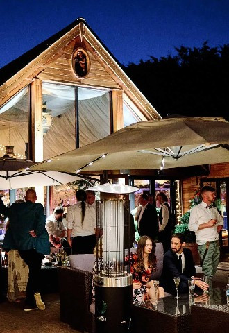 guest enjoying the evening air at the crazy bear stadhampton oxfordshire