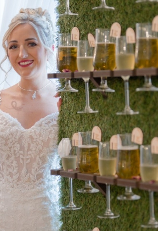 Bride with prosecco wall