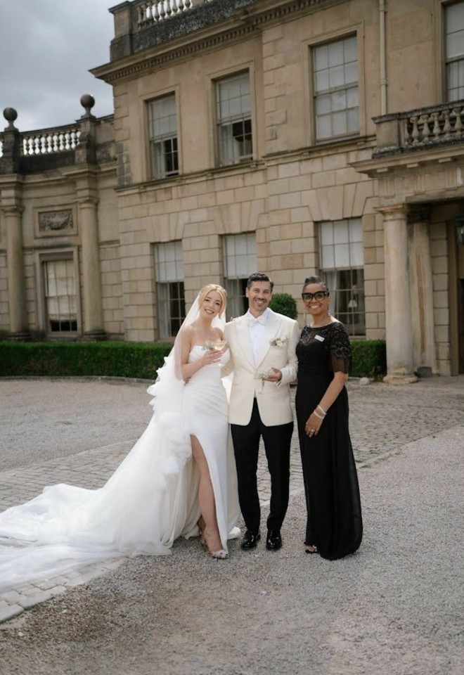 Jennifer Patrice, an experienced Independent Celebrant, with a happy couple on their wedding day, delivering an authentic, joyful, and personalised ceremony in a beautiful setting.