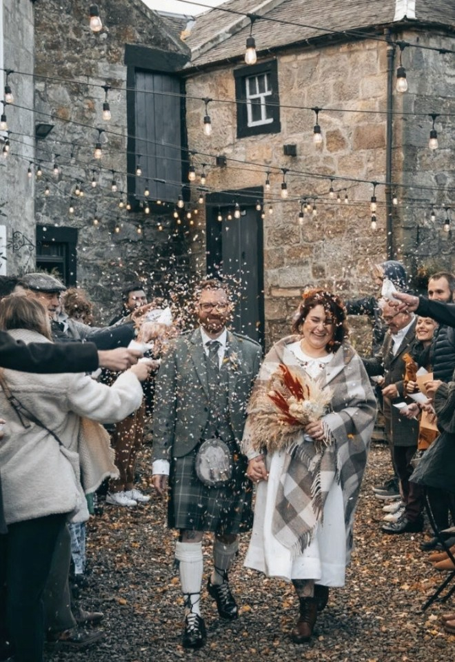 Confetti throw in the courtyard at Folkerton Mill 