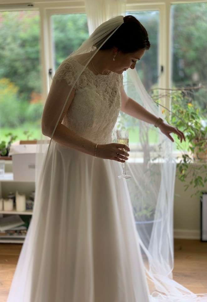 Bride wedding dress reveal. Shot by Love Stories Live Wedding Content Creator. 