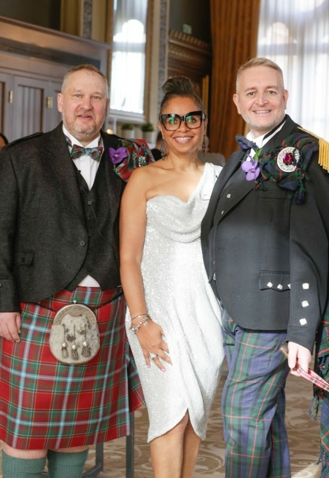 Jennifer Patrice, an experienced Independent Celebrant, with a happy couple on their wedding day, delivering an authentic, joyful, and personalised ceremony in a beautiful setting.