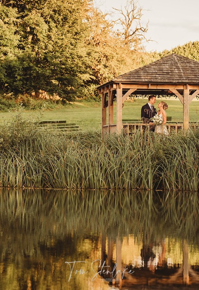 bride and groom on gazebo