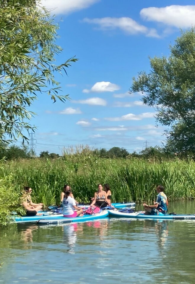 People paddleboarding together