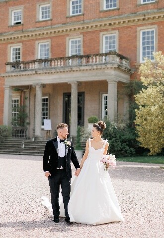 Bride and groom outside wedding venue 