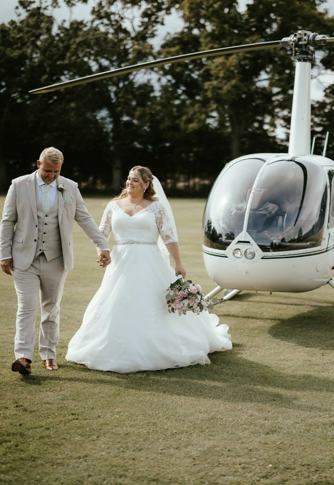 arrive in style at Hungarian hall estate by helicopter, bride & groom arrival