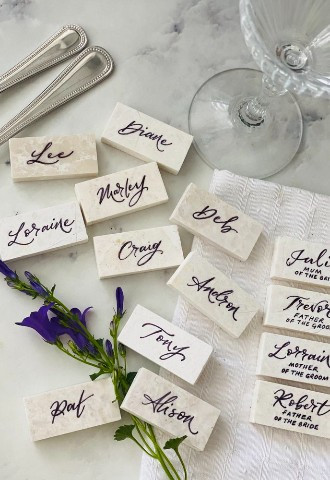 Marble wedding name places for guests with calligraphy from Mint Lettering Buckinghamshire