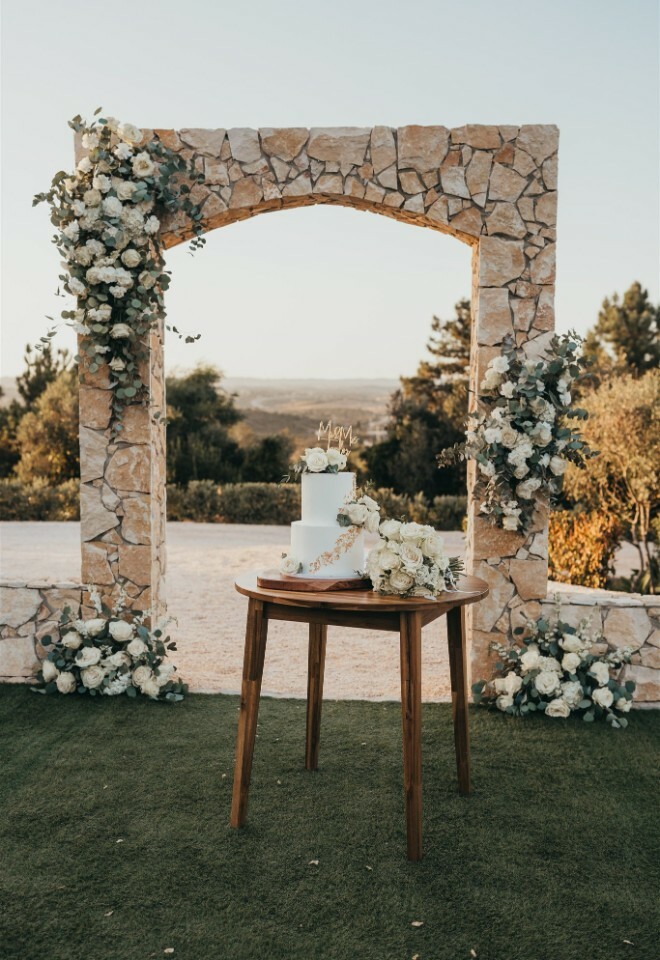 Focal point at Sunset for a cake cutting, using ceremony arch and flowers at Casa Monte Cristo