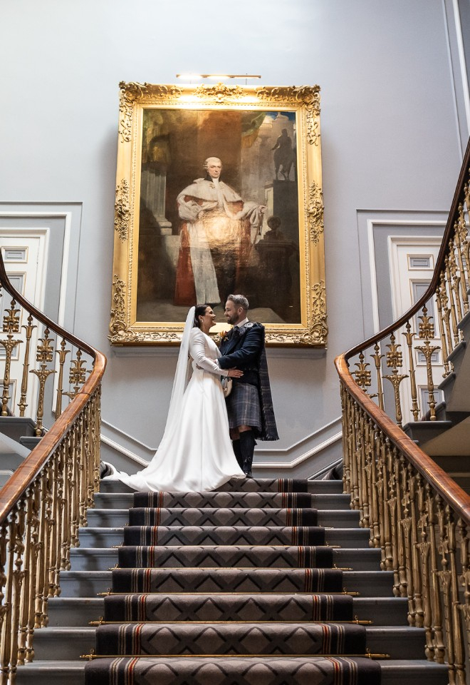 Signet Library weddings, bride & groom on the staircase