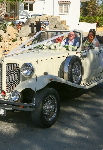 White Bridal car with flowers and ribbons arriving at the wedding reception, exclusive yacht weddings in cyprus