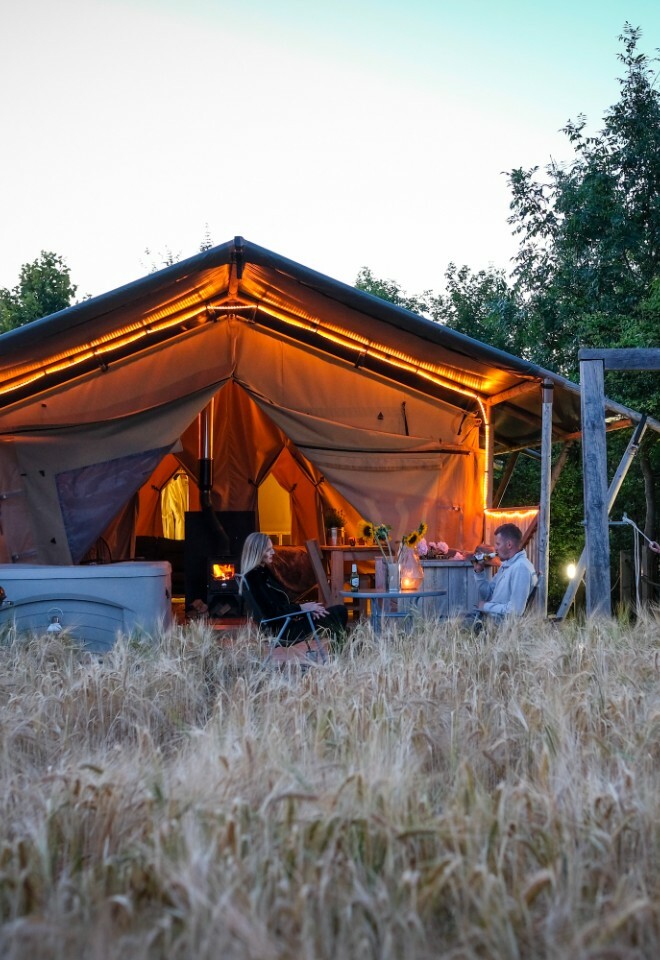 The Chilterns View Couple sitting outside marquee photo