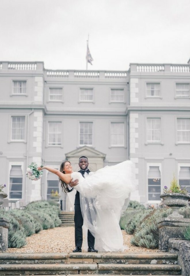 A couple outside the Mansion House.
