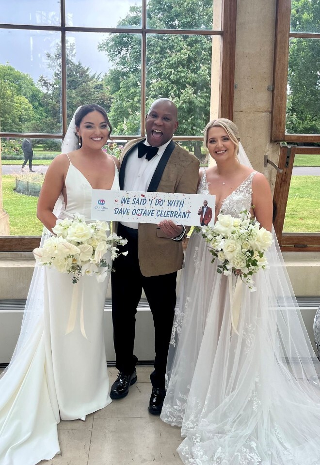 Dave Octave Celebrant with a happy brides smiling and holding my We said I Do with Dave Octave Celebrant sign.