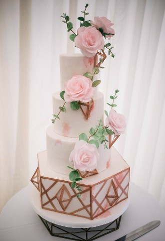 Pink sugar roses with rose gold geometric shapes with watercolour effect wedding cake by Dolce Lusso Cakes