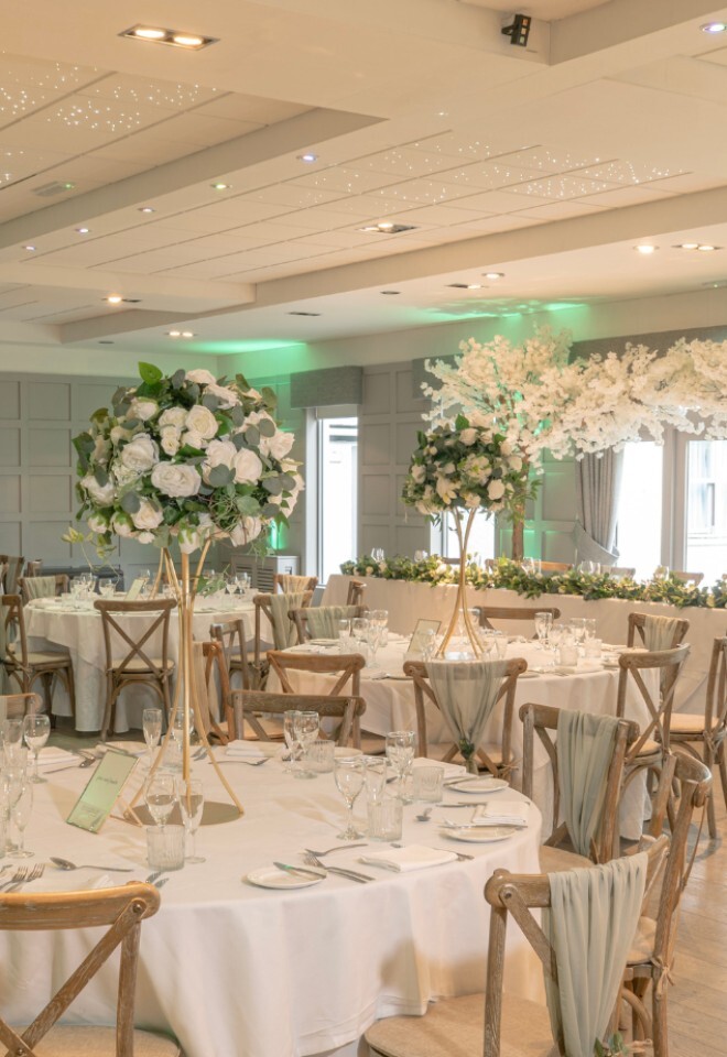 Wedding breakfast setting with white and green colour scheme
