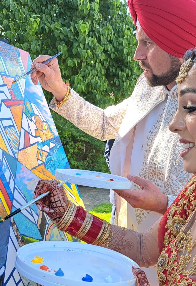guest painting at wedding