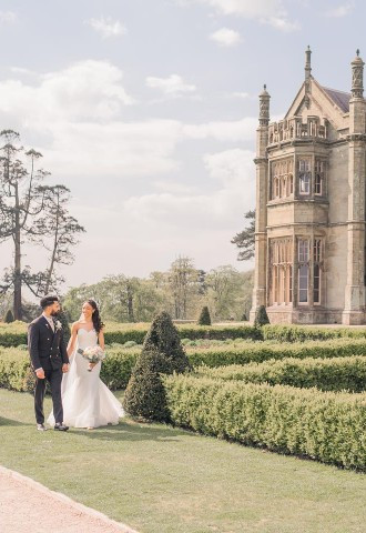 Bride and groom walk around the grounds at Margam Orangery, South Wales