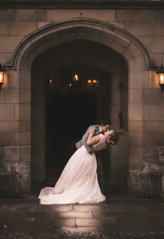 Wedding couple at entrance  Melville Castle - a castle wedding venue near Edinburgh