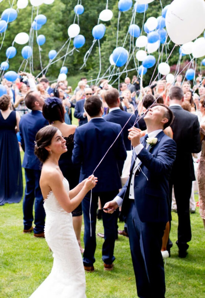 Bride and Groom holding balloons civil ceremonies Essex