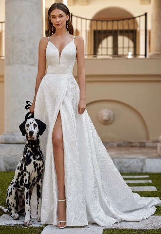 Evan from Rosa Clara 2024 collection Classic A-line wedding dress, crafted in brocade rama. Featuring a plunging neckline, V-back and skirt with a front slit