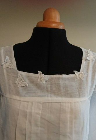 Upcycled mothers wedding dress for her daughter with applique butterflies