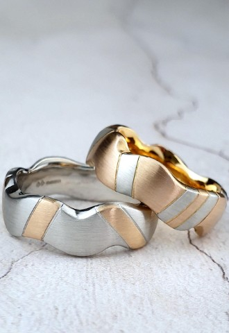 Unique wedding rings in platinum and gold shown in opposite colour ways