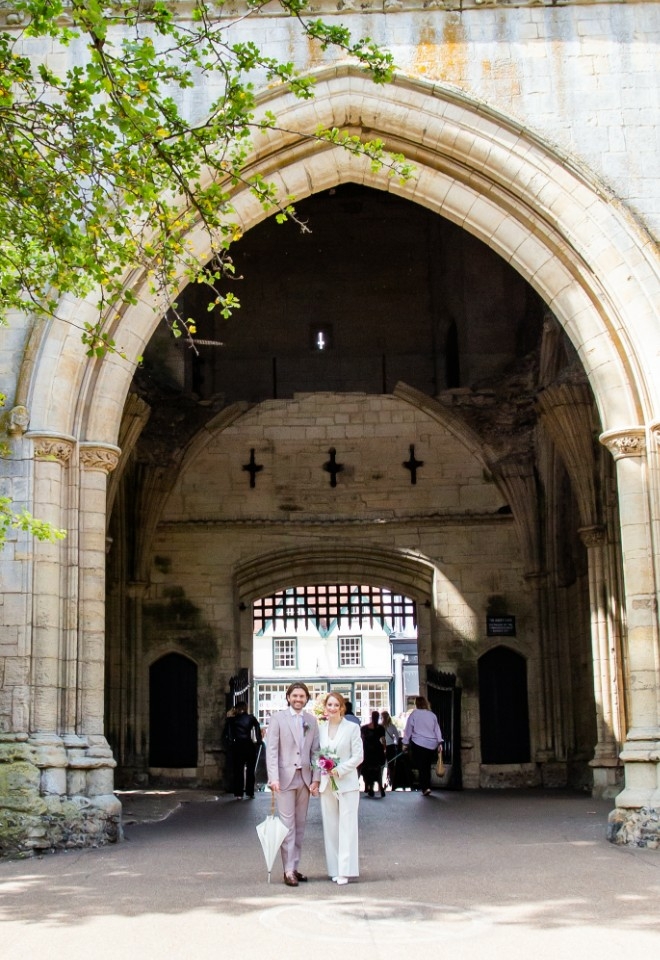 Bury Register Office wedding - couple under Abbey Gate