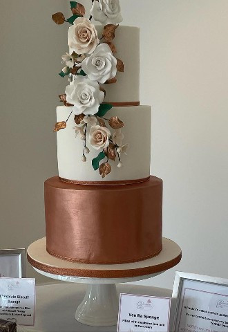 Cup cake wedding cake with one tier aThree tier wedding cake with sugar flowers and metallic finish made by Celebration Cakes by Catherine Scott in Oxfordshire