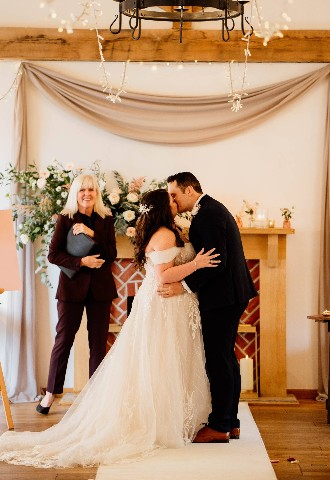 The couple share a kiss at Burley Manor New Forest celebrant led ceremony. Conducted and written by Sally 