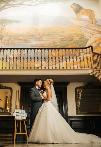 wedding couple at West Midlands Safari Park near the safari mural