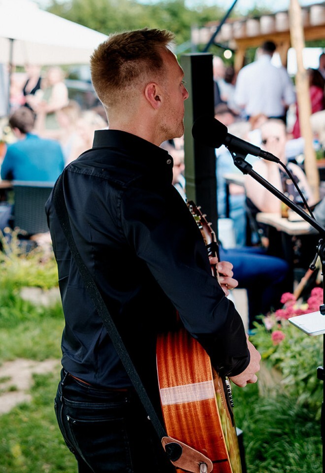 Guitarist performs at a countryside wedding in Essex