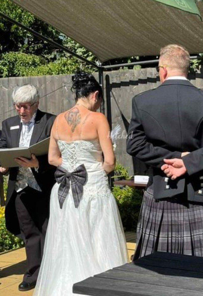 Jane with bride and groom wearing a kilt