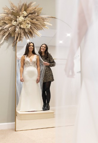 Bride trying on wedding dress at Your Story bridal boutique