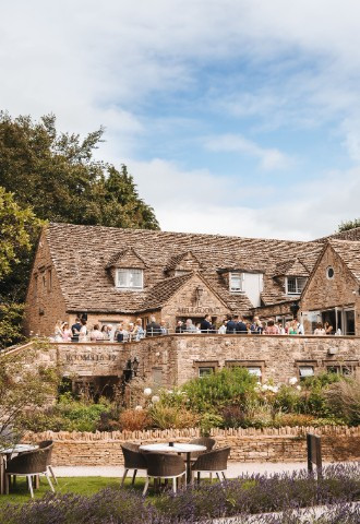 Wedding guests on terrace at The Frogmill