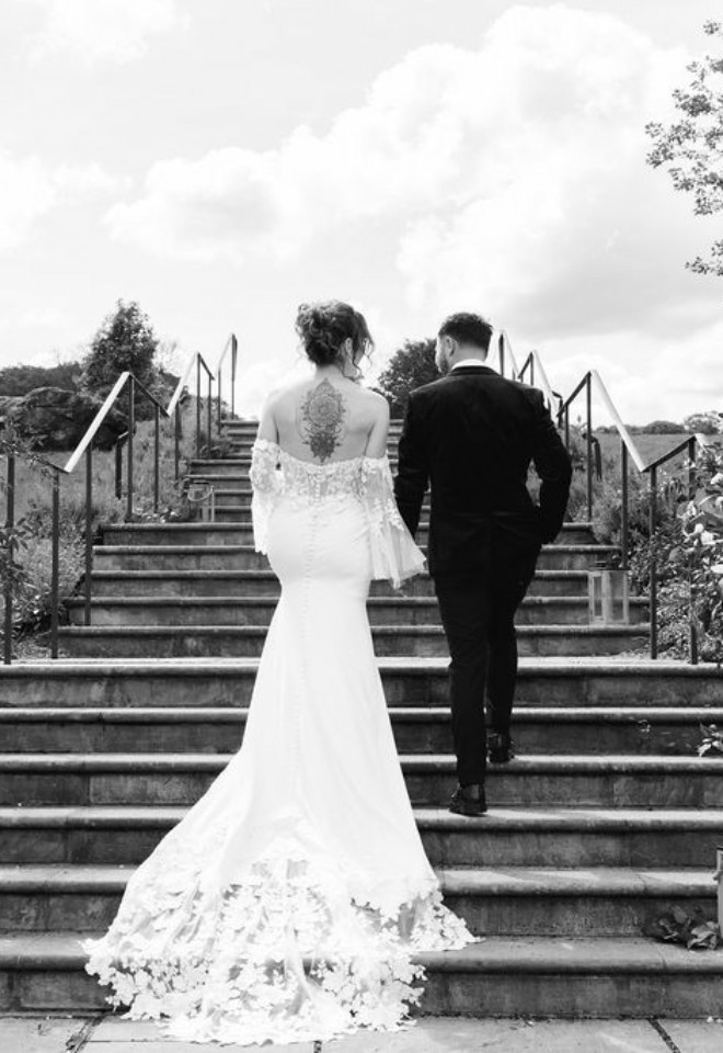 Bride & Groom Walking up stairs 