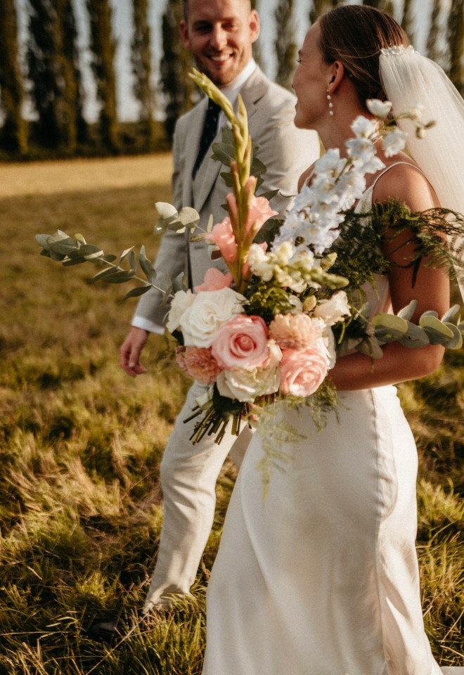 Couple in front of poplar trees in the Hampshire countryside