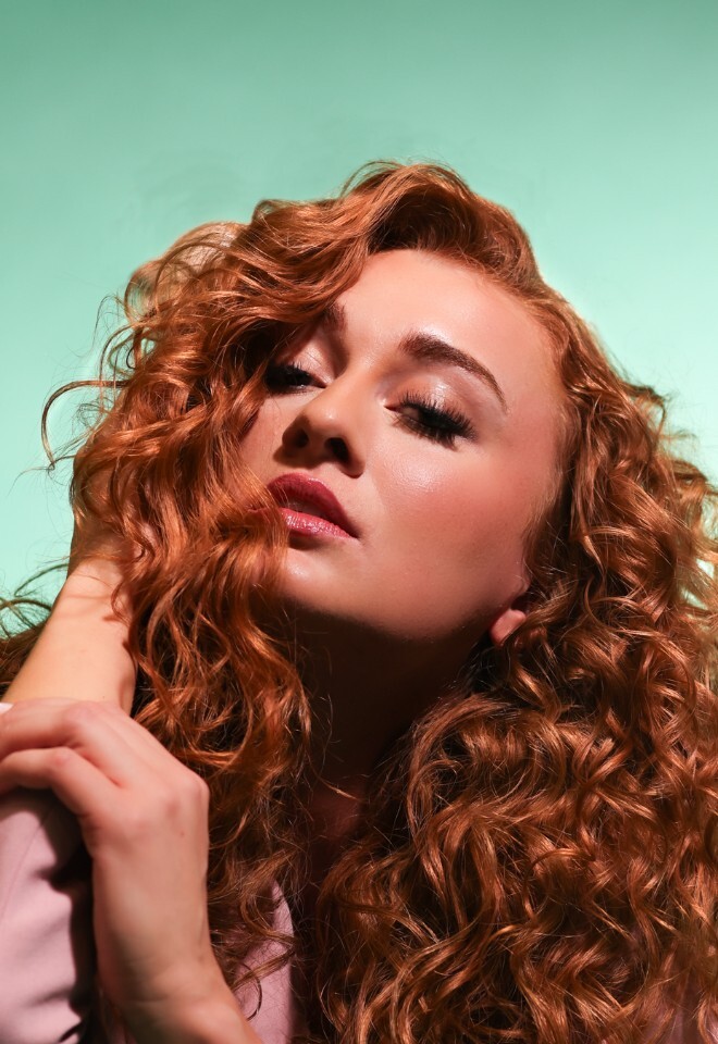 Natural soft glam makeup with luminous skin – enhancing features with a soft, romantic finish.