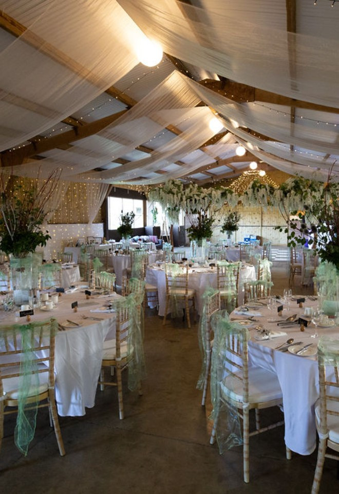 Barn dressed with drapes and fairy lights