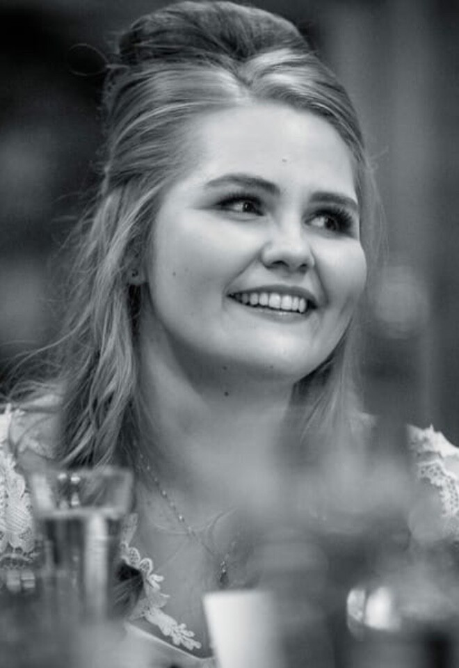 Bride smiling with soft glam bridal makeup on her wedding day.