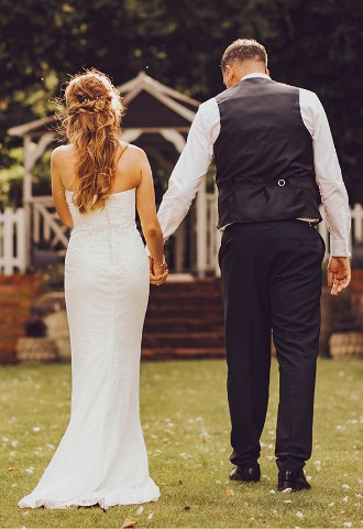 Wedding couple in the garden at The Elephant Hotel - a wedding venue in Berkshire